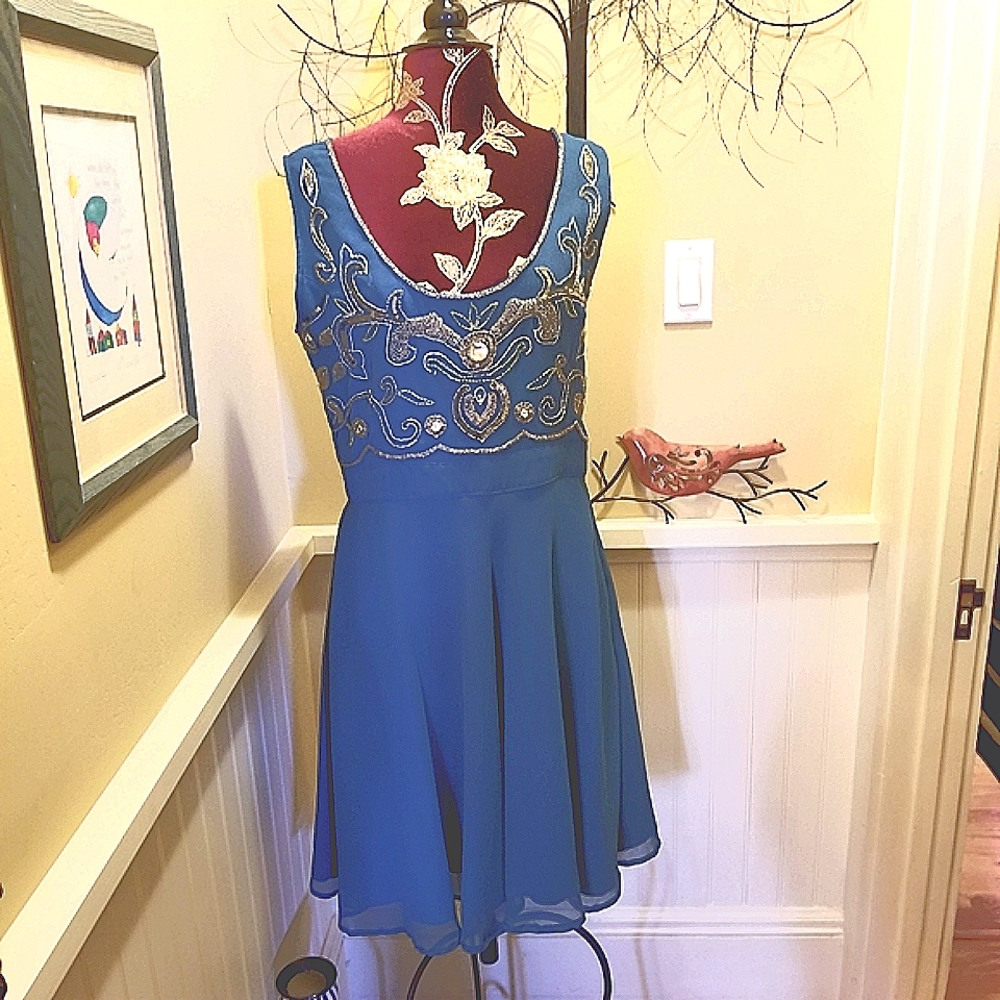 Beautiful teal dress with gorgeous beadwork.